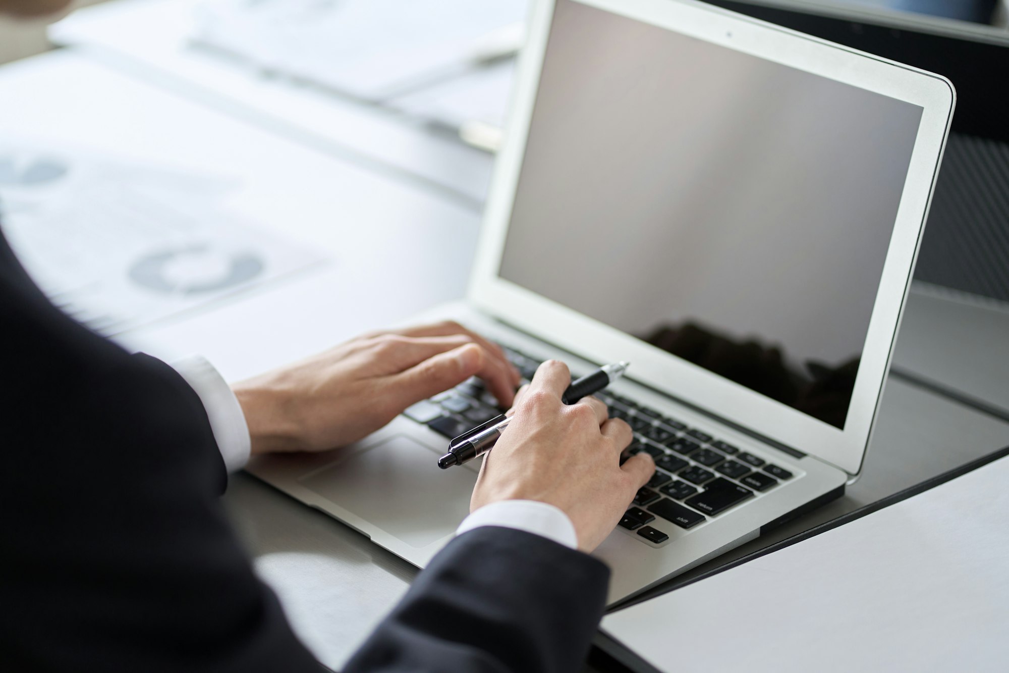 Business professional installing Tolling Vision on a laptop