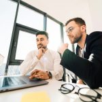 Developers integrating Tolling Vision on a laptop during team review
